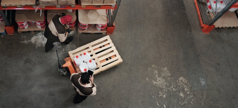 Men working in a distribution and logistics warehouse
