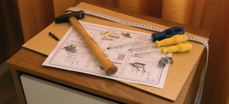 Tools and paper instruction for furniture assembly